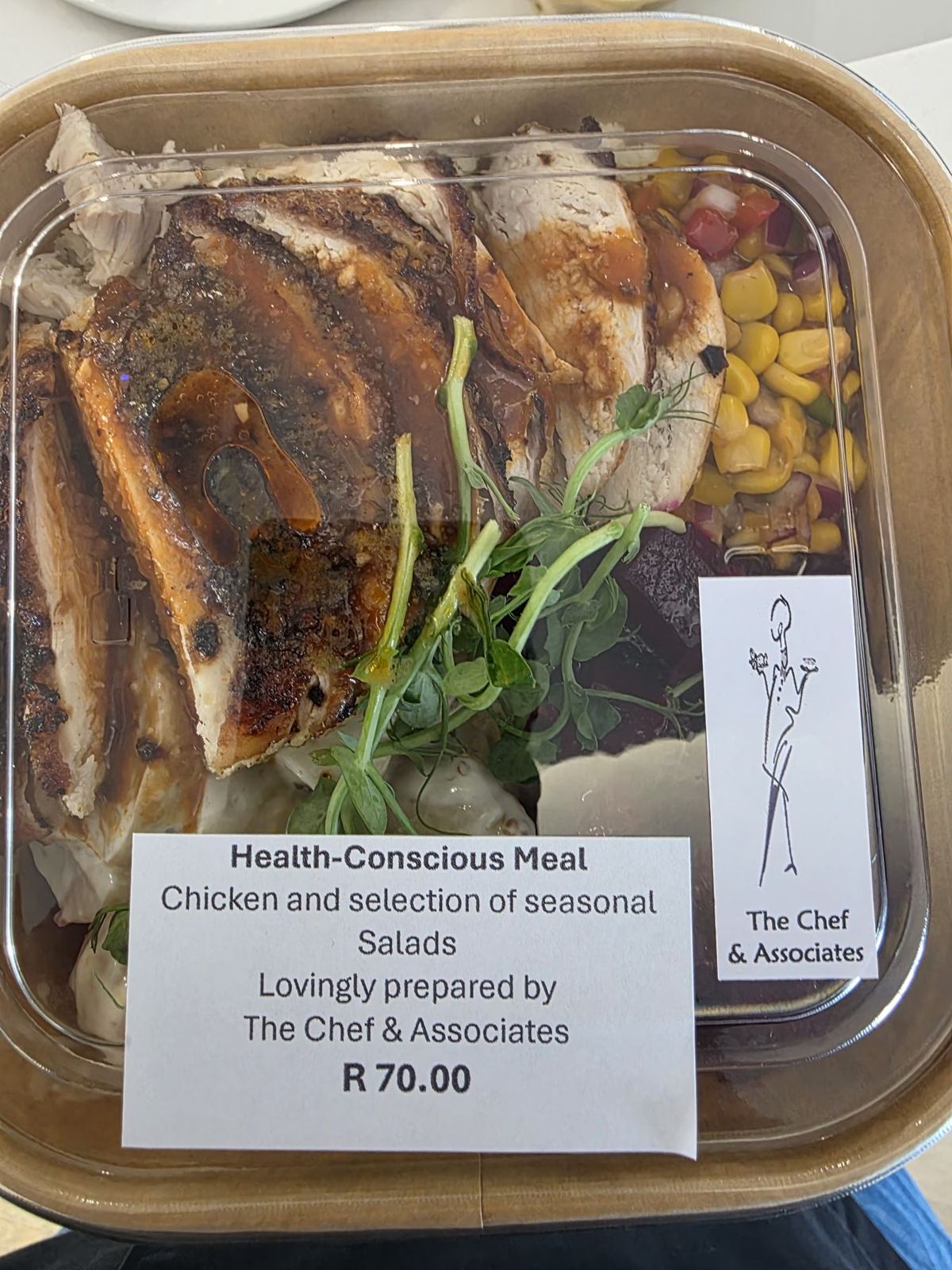 A packed health-conscious meal of chicken and seasonal salads with a The Chef & Associates label